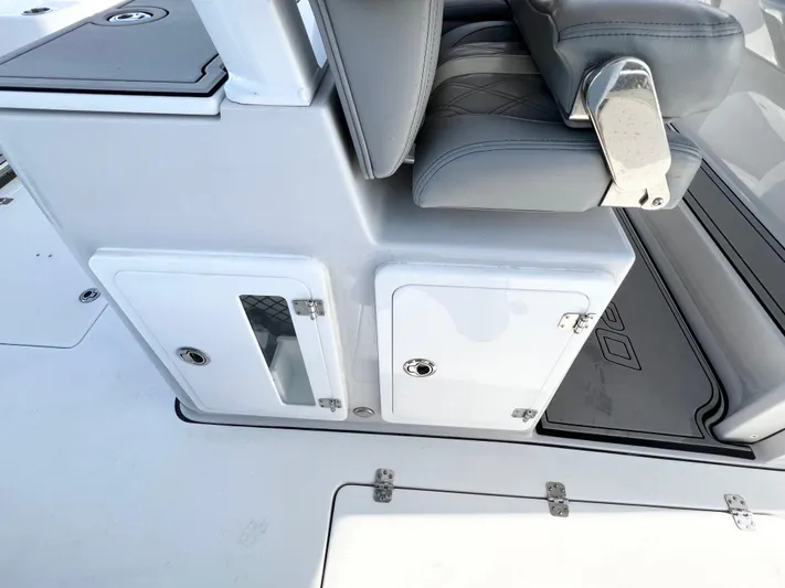  Yacht Photos Pics 2022 Sea Pro 320 DLX Offshore boat seating and storage compartments.