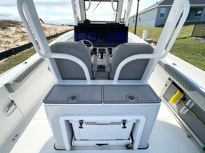  Yacht Photos Pics 2022 Sea Pro 320 DLX Offshore boat interior with helm and seating area.
