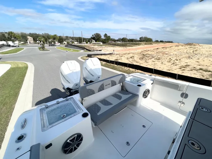  Yacht Photos Pics 2022 Sea Pro 320 DLX Offshore boat with dual engines and spacious seating area.