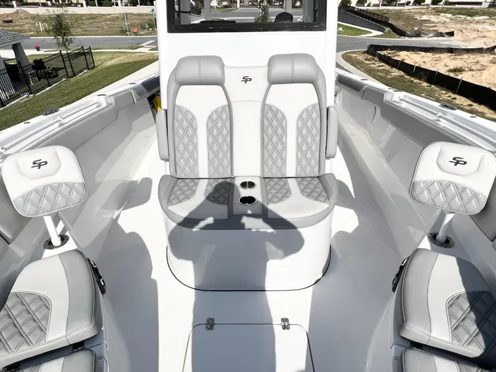  Yacht Photos Pics 2022 Sea Pro 320 DLX Offshore boat interior with luxurious seating and cup holders.