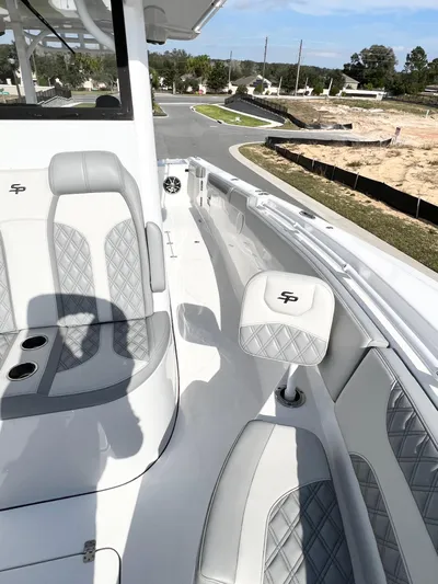  Yacht Photos Pics 2022 Sea Pro 320 DLX Offshore boat interior with gray seating and cup holders.