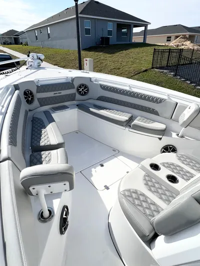  Yacht Photos Pics 2022 Sea Pro 320 DLX Offshore boat with luxurious seating and modern design.
