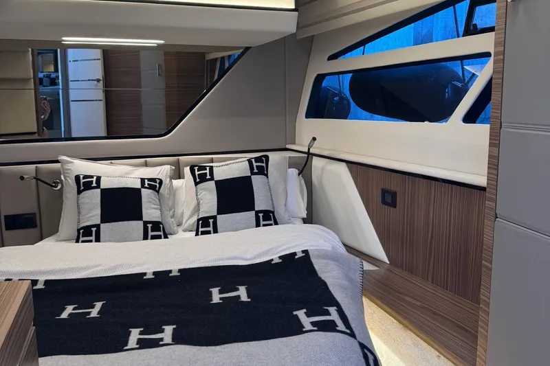 Custom Order Yours Today! Yacht Photos Pics Luxurious bedroom interior of 2026 Cobrey 45 FLY yacht with elegant bedding and modern design.