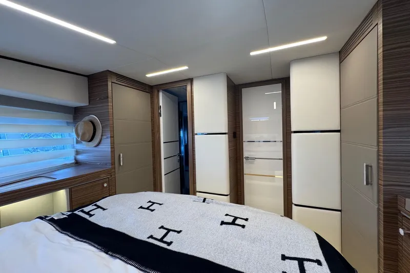 Custom Order Yours Today! Yacht Photos Pics Luxurious interior of 2026 Cobrey 45 FLY yacht bedroom with modern design elements.