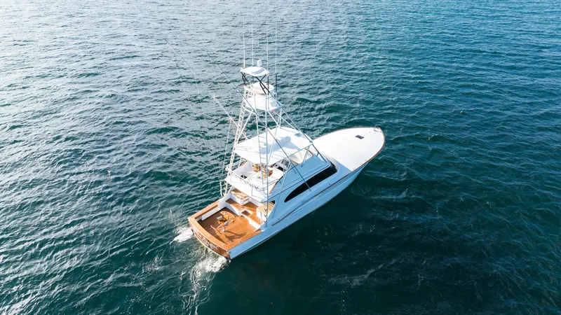 Blue Angel Yacht Photos Pics Aerial view of a 2013 Garlington 61 Convertible yacht cruising on the ocean.