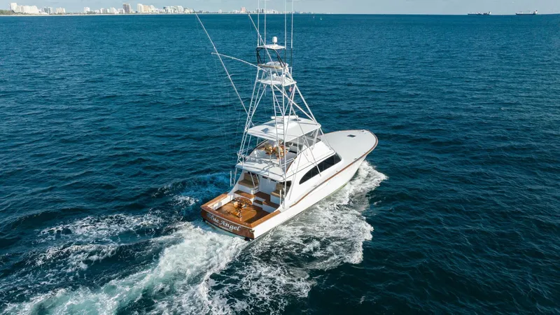 Blue Angel Yacht Photos Pics 2013 Garlington 61 Convertible yacht cruising on open water.