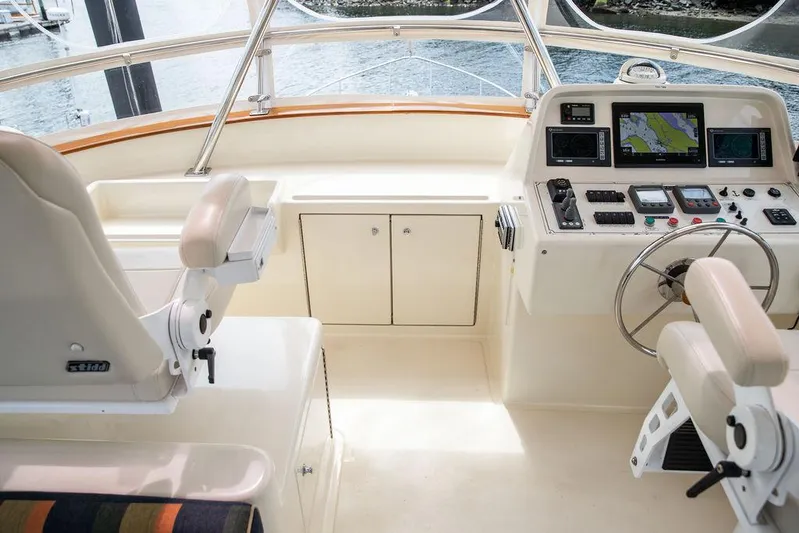 Grace Yacht Photos Pics Flybridge helm of 2007 Vicem 54 Classic, featuring navigation equipment and steering wheel.