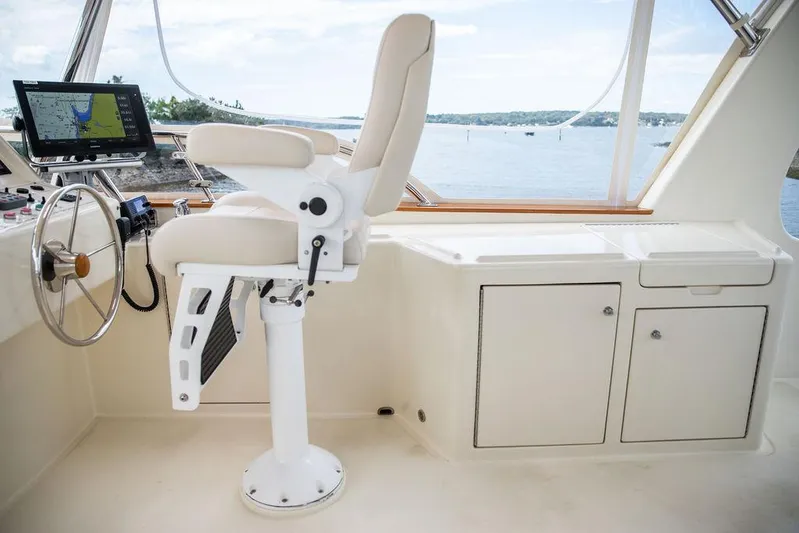 Grace Yacht Photos Pics 2007 Vicem 54 Classic Flybridge helm with captain's chair and navigation equipment.