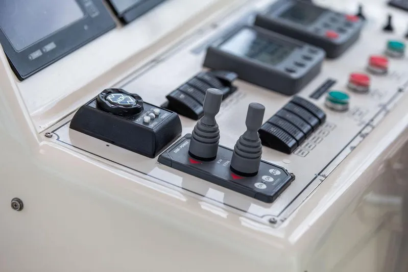 Grace Yacht Photos Pics Control panel of a 2007 Vicem 54 Classic Flybridge yacht with joysticks and gauges.