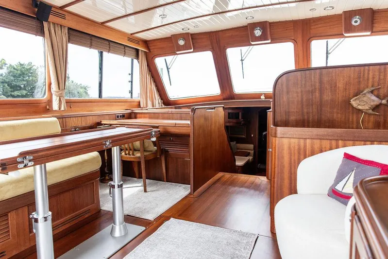 Grace Yacht Photos Pics Luxurious interior of 2007 Vicem 54 Classic Flybridge yacht with elegant wood finishes.