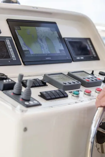 Grace Yacht Photos Pics Control panel of 2007 Vicem 54 Classic Flybridge yacht with navigation screens and controls.