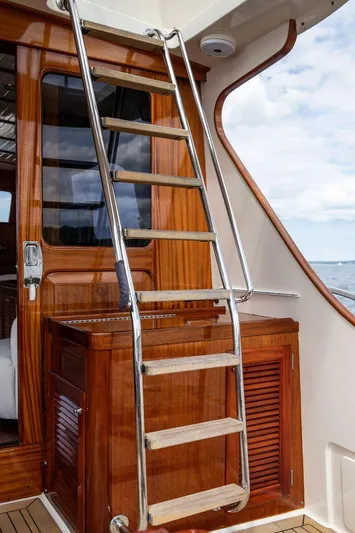 Grace Yacht Photos Pics Stainless steel ladder on 2007 Vicem 54 Classic Flybridge yacht with wooden finish.