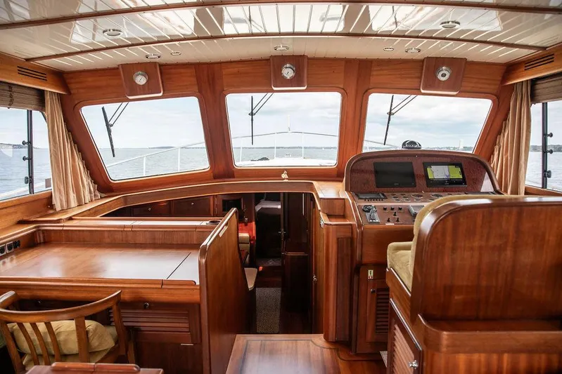 Grace Yacht Photos Pics Interior of 2007 Vicem 54 Classic Flybridge yacht with wooden finish and navigation controls.