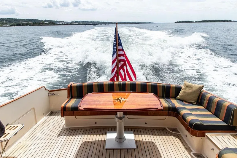 Grace Yacht Photos Pics 2007 Vicem 54 Classic Flybridge yacht with American flag, cruising on open water.