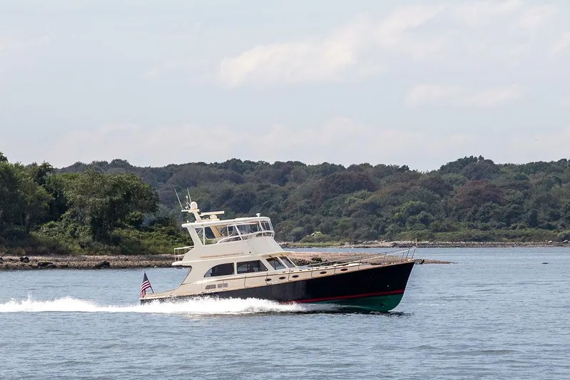 Grace Yacht Photos Pics 2007 Vicem 54 Classic Flybridge yacht cruising on a scenic waterway.