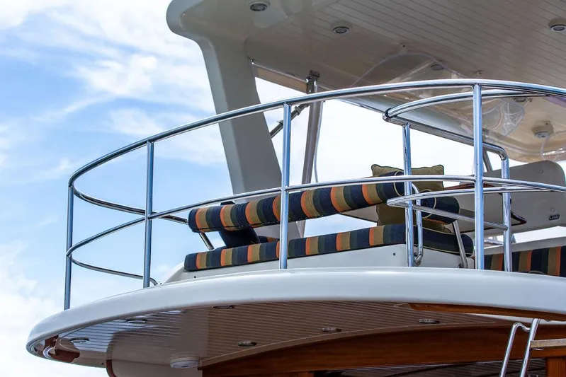 Grace Yacht Photos Pics Flybridge of 2007 Vicem 54 Classic, featuring striped seating and sleek railing design.