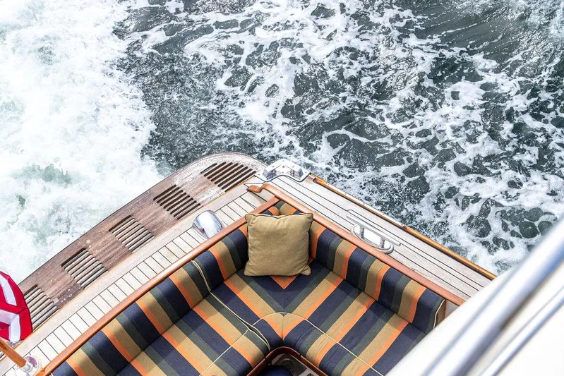 Grace Yacht Photos Pics Vicem 54 Classic Flybridge 2007 yacht with striped seating and ocean waves.