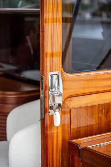 Grace Yacht Photos Pics Vicem 54 Classic Flybridge 2007 yacht interior with polished wood and chrome handle detail.