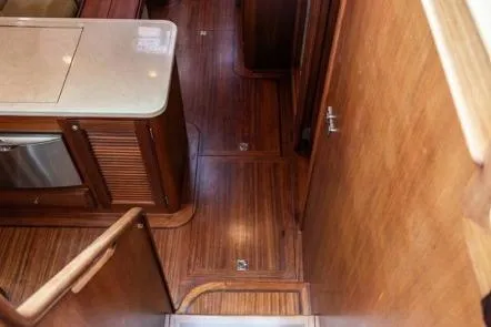 Grace Yacht Photos Pics Interior of 2007 Vicem 54 Classic Flybridge with wooden flooring and cabinetry.