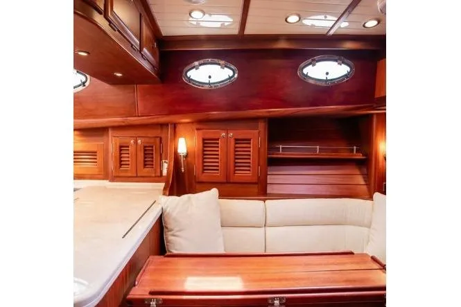 Grace Yacht Photos Pics Luxurious 2007 Vicem 54 Classic Flybridge yacht interior with elegant wood finish and plush seating.
