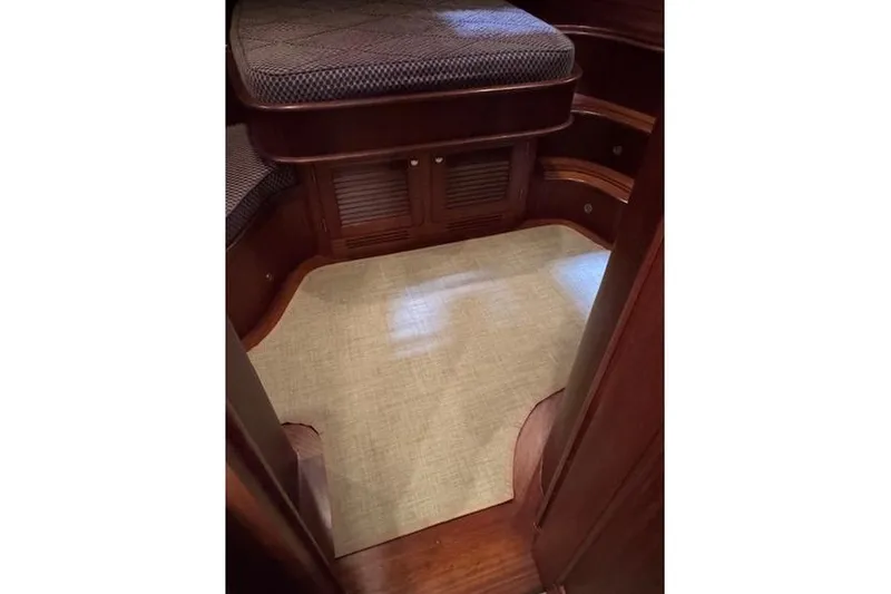 Grace Yacht Photos Pics Interior of 2007 Vicem 54 Classic Flybridge with wooden cabinetry and carpeted floor.