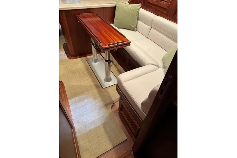 Grace Yacht Photos Pics Interior of 2007 Vicem 54 Classic Flybridge with elegant seating and wooden table.