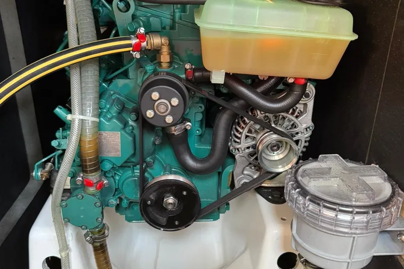 Insania Yacht Photos Pics Engine compartment of a 2019 Dufour 360 Grand Large sailboat, showcasing mechanical components.