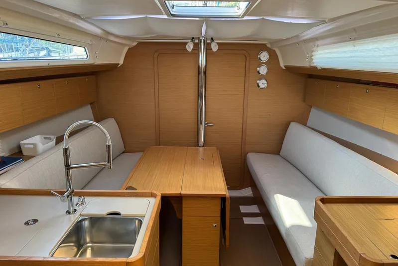 Insania Yacht Photos Pics Interior of 2019 Dufour 360 Grand Large sailboat with modern wood finish.