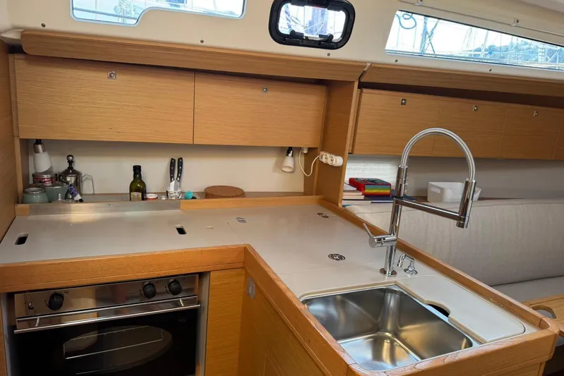 Insania Yacht Photos Pics Modern kitchen in 2019 Dufour 360 Grand Large yacht with sleek wood cabinetry.