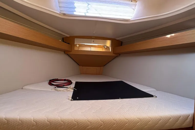 Insania Yacht Photos Pics 2019 Dufour 360 Grand Large cabin interior with bed and skylight.