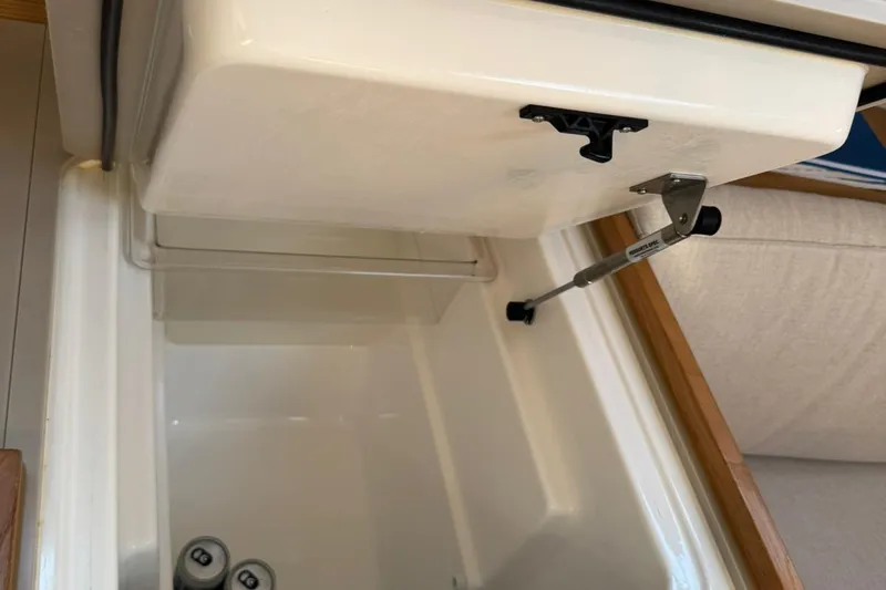 Insania Yacht Photos Pics Open storage compartment in 2019 Dufour 360 Grand Large yacht interior.