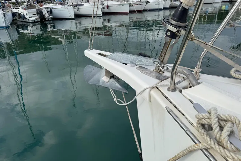 Insania Yacht Photos Pics Bow of 2019 Dufour 360 Grand Large sailboat with anchor, docked in marina.