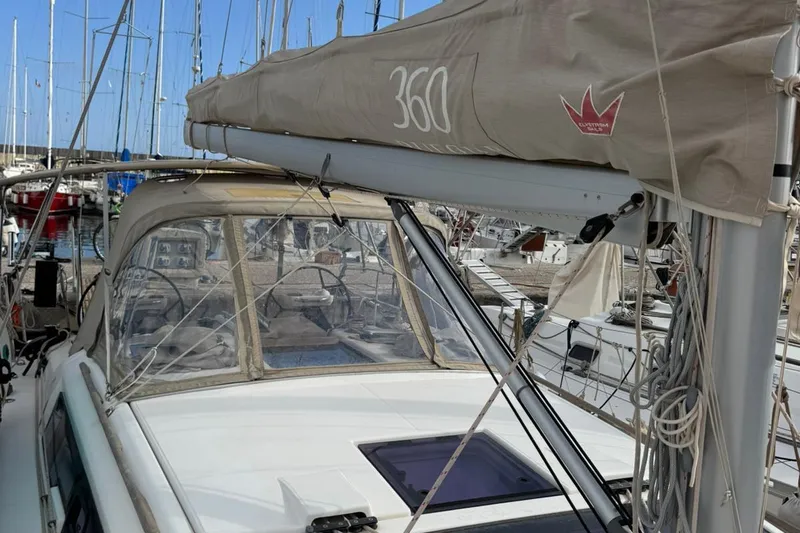 Insania Yacht Photos Pics 2019 Dufour 360 Grand Large sailboat docked in marina, featuring cockpit and rigging.