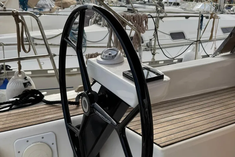 Insania Yacht Photos Pics Steering wheel and compass on 2019 Dufour 360 Grand Large sailboat deck.
