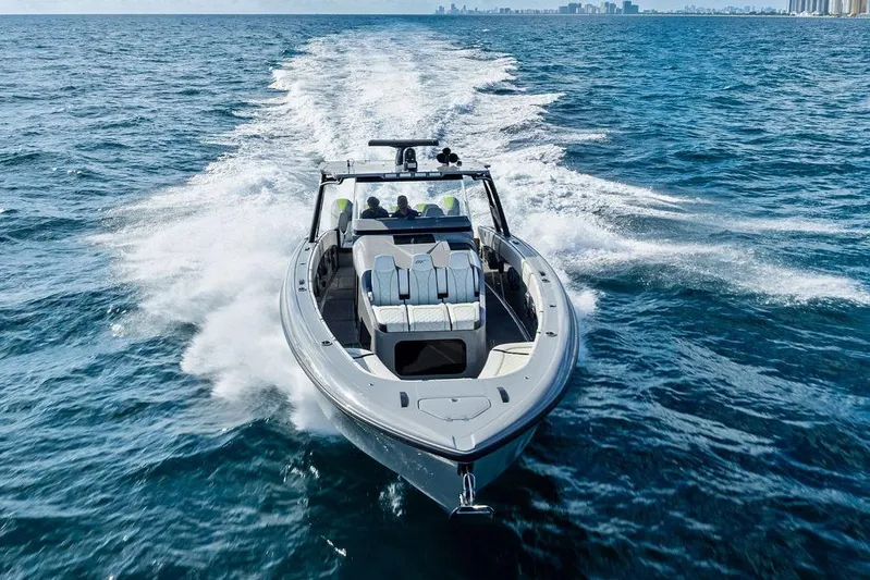 Trigger Yacht Photos Pics 2022 Midnight Express 43' Solstice boat cruising on open water.