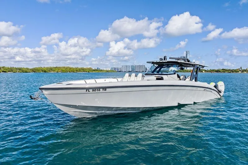 Trigger Yacht Photos Pics 2022 Midnight Express 43' Solstice boat on clear blue water under a sunny sky.