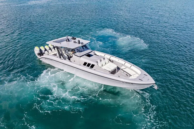 Trigger Yacht Photos Pics 2022 Midnight Express 43' Solstice boat cruising on clear blue ocean waters.