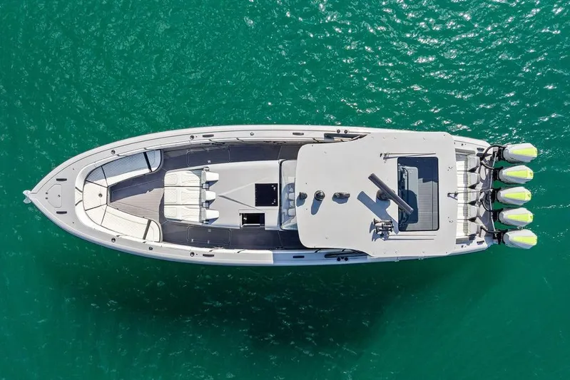 Trigger Yacht Photos Pics Aerial view of 2022 Midnight Express 43' Solstice boat on turquoise water.