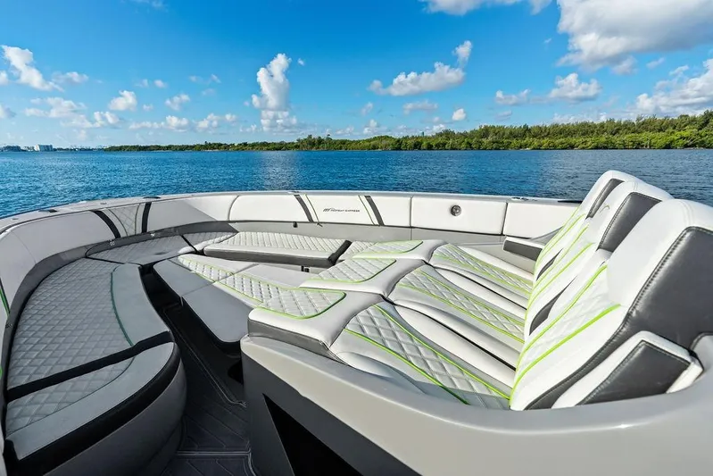 Trigger Yacht Photos Pics Luxurious seating on 2022 Midnight Express 43' Solstice boat, with scenic water view.