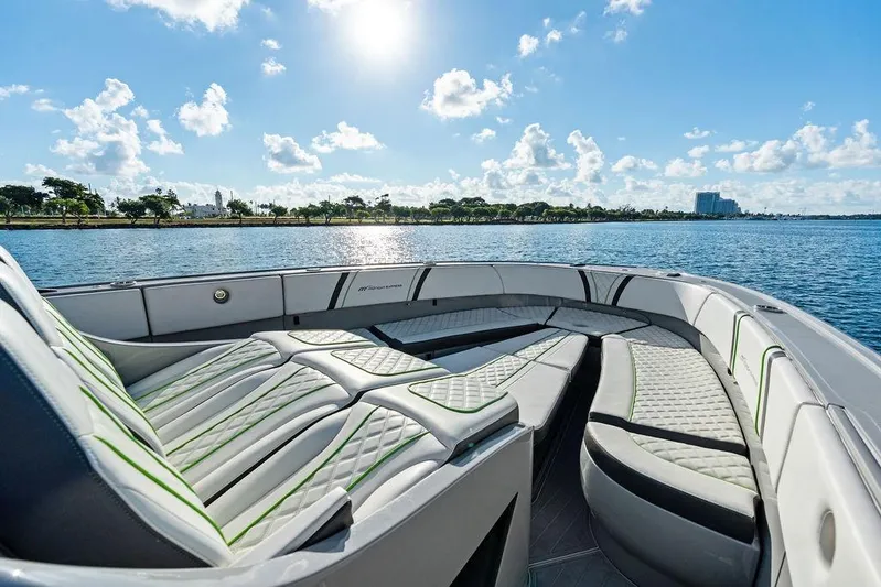 Trigger Yacht Photos Pics 2022 Midnight Express 43' Solstice boat interior with luxurious seating on a sunny day.