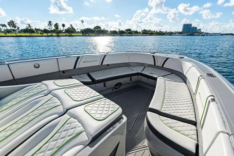 Trigger Yacht Photos Pics Luxurious seating on 2022 Midnight Express 43' Solstice boat, with scenic waterfront view.