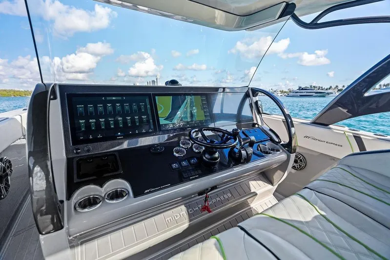 Trigger Yacht Photos Pics 2022 Midnight Express 43' Solstice boat dashboard with advanced navigation system on open water.