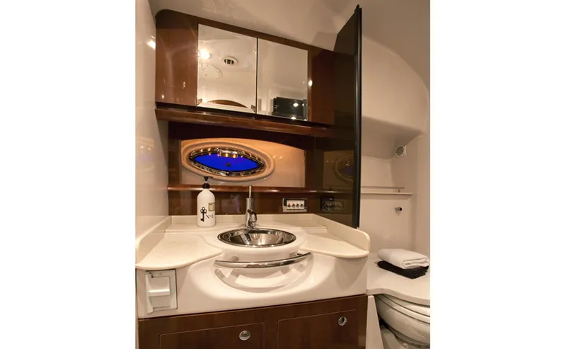  Yacht Photos Pics Manufacturer Provided Image: Luxurious bathroom in 2013 Four Winns Vista 375 yacht with sink, mirror, and porthole.