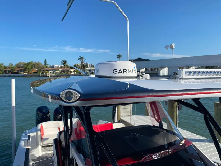  Yacht Photos Pics 2020 Nor-Tech 390 Sport Center Console with Garmin radar, docked by the water.