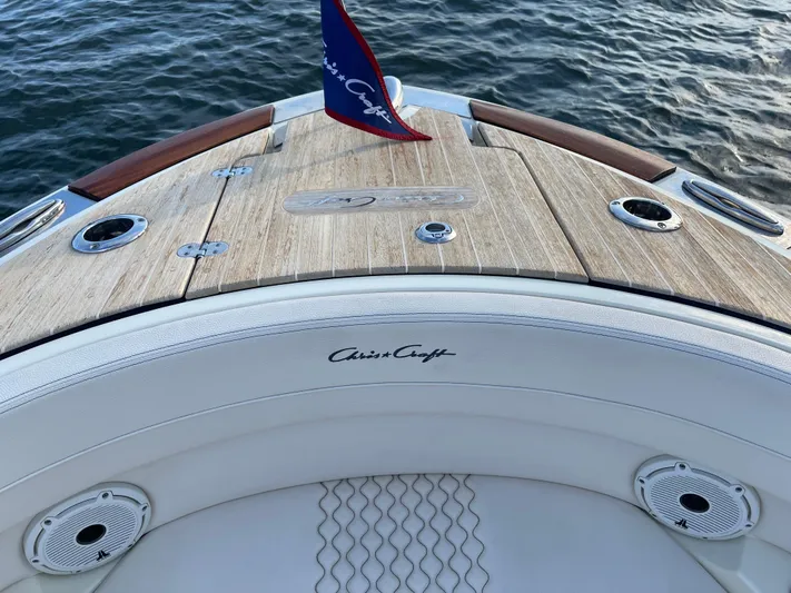  Yacht Photos Pics 2021 Chris-Craft 28 LAUNCH GT boat deck with wood finish and logo.