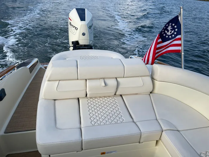 Yacht Photos Pics 2021 Chris-Craft 28 LAUNCH GT boat with outboard motor and American flag.