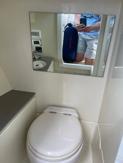  Yacht Photos Pics 2021 Chris-Craft 28 Launch GT boat bathroom with mirror and toilet.