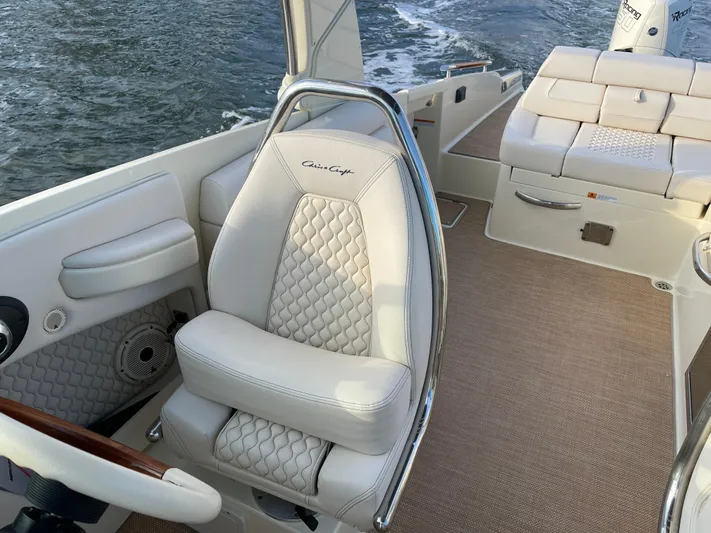  Yacht Photos Pics 2021 Chris-Craft 28 Launch GT boat interior with luxurious seating and water view.