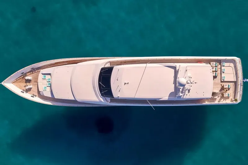 Let It Be Yacht Photos Pics Aerial view of 1998 Tecnomarine 118 yacht on clear blue water.