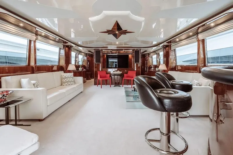 Let It Be Yacht Photos Pics Luxurious interior of 1998 Tecnomarine 118 yacht with elegant seating and modern decor.